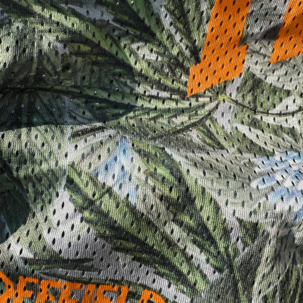 Close up of the breathable camo mesh fabric on Run High Camobis shorts